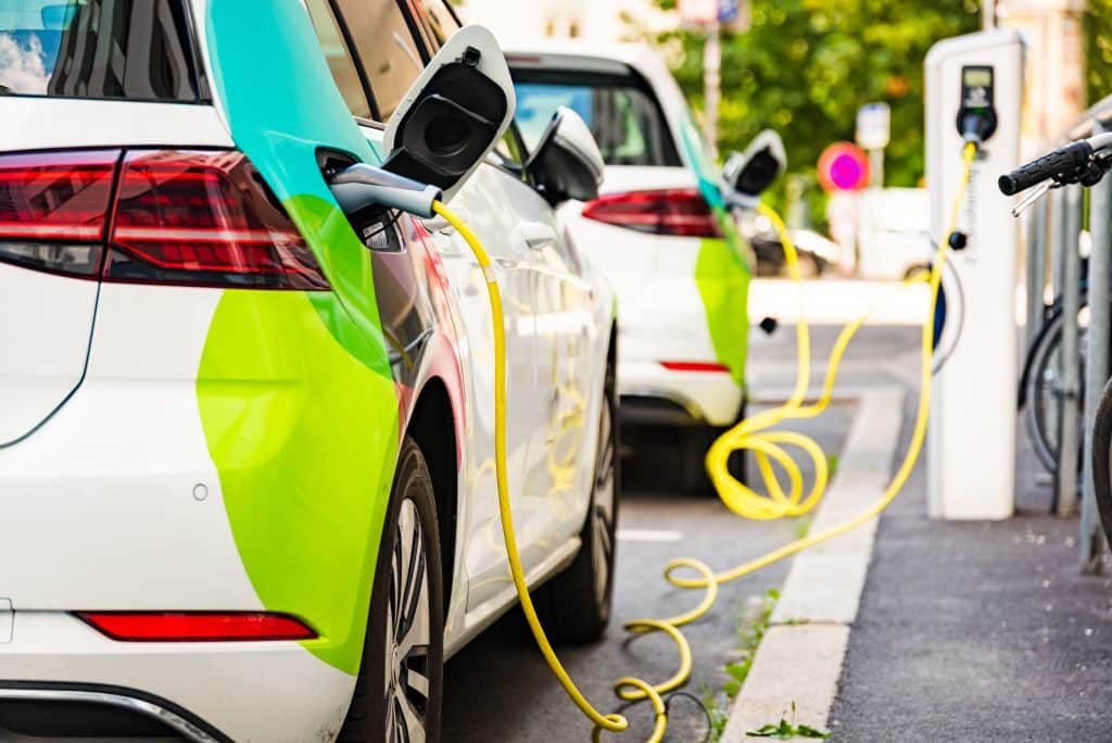 Charging battery of an electric car in city.